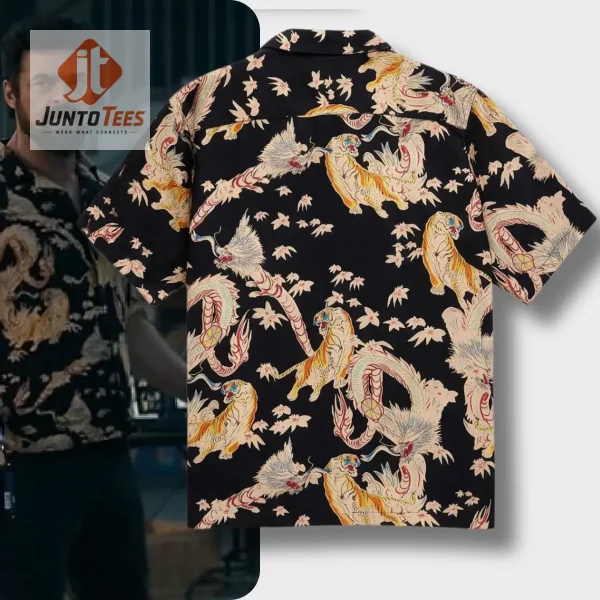 Back view of a black Hawaiian shirt featuring a repeating tiger and dragon print in gold and white tones.