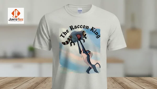 Graphic t-shirt with Raccoon King parody illustration on black cotton fabric