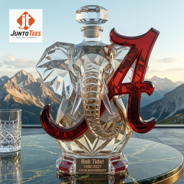 Geometric glass elephant decanter with crimson logo on a study desk. (Detail view #3)
