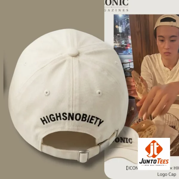 A close-up lifestyle shot of the ICONIC cap worn in a cafe setting with bread.