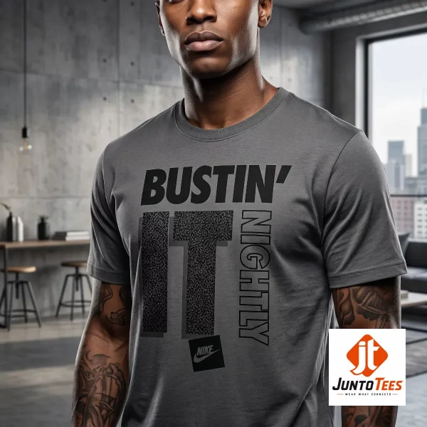 CJ McCollum Nike "Bustin' It Nightly" graphic t-shirt 1 A person wearing the white graphic t-shirt in an indoor basketball gym setting.
