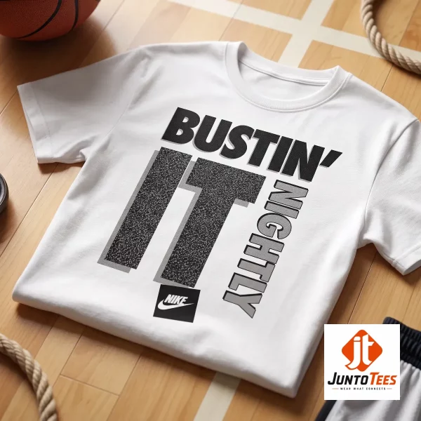 CJ McCollum Nike "Bustin' It Nightly" graphic t-shirt 2 A front view of a white crew neck t-shirt showing the stylized Bustin' It Nightly graphic. (Detail view #3)