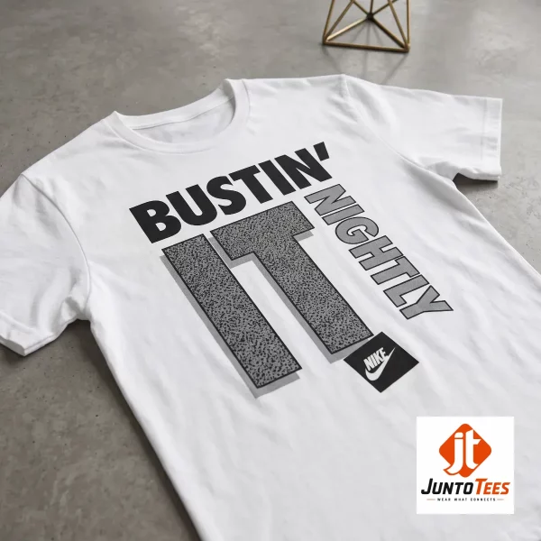 CJ McCollum Nike "Bustin' It Nightly" graphic t-shirt 3 A front view of a white crew neck t-shirt showing the stylized Bustin' It Nightly graphic. (Detail view #4)
