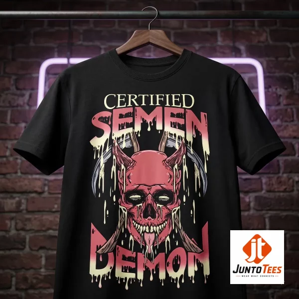 Matt Rife ProbleMATTic Certified Semen Demon Metal Skull Graphic T-Shirt 2 A black cotton crew neck shirt featuring a demonic skull graphic with scythes and melting text on a wooden surface. (Detail view #3)