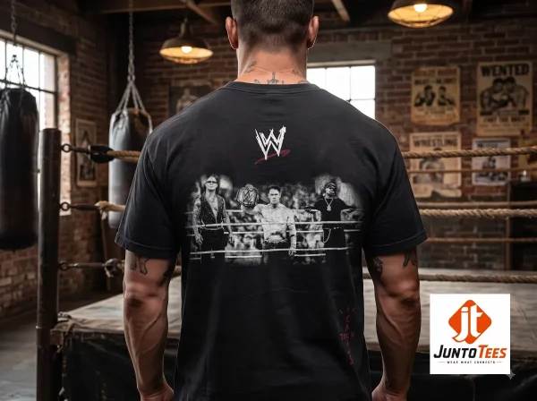 Rey Mysterio Travis Scott WWE Wrestling Is Real T-Shirt 2 A close-up view of a black graphic t-shirt displaying white vintage-inspired Wrestling Is Real text. (Detail view #3)