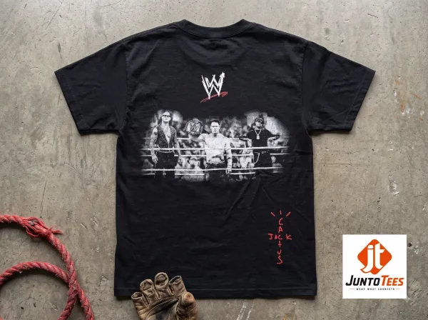 Rey Mysterio Travis Scott WWE Wrestling Is Real T-Shirt 5 A close-up view of a black graphic t-shirt displaying white vintage-inspired Wrestling Is Real text. (Detail view #6)