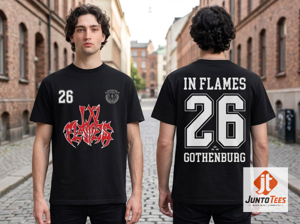 Front view of black In Flames graphic t-shirt with red and white logo and number 26 on a concrete background. (Detail view #5)