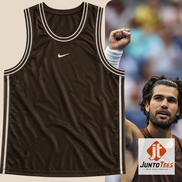 Close-up of the Cactus Jack x Nike brown jersey graphic on a stationery surface.