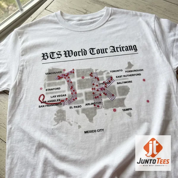 Front view of a white BTS Arirang Tour t-shirt with a graphic USA map and JK initials in a rhinestone-style print.
