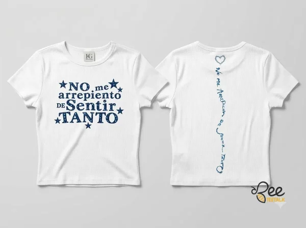 Front and back view of a white Karol G baby tee with navy blue lyric graphics and star details.